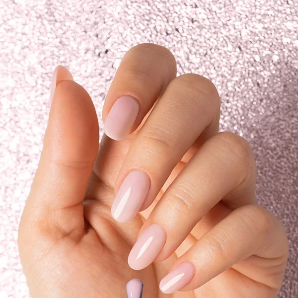Passione Beauty nude pink glossy gel polish on almond-shaped nails, natural look professional manicure for nail artists